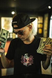 man holding US dollar banknotes